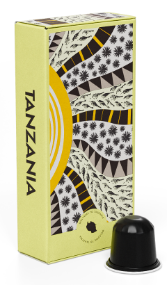 A colorful box labeled "Tanzania" with vibrant patterns, next to a black coffee capsule.