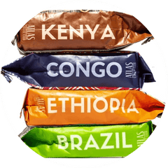 Bags of coffee from Kenya, Congo, Ethiopia and Brazil stacked on top of each other.