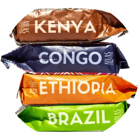 Bags of coffee from Kenya, Congo, Ethiopia and Brazil stacked on top of each other.